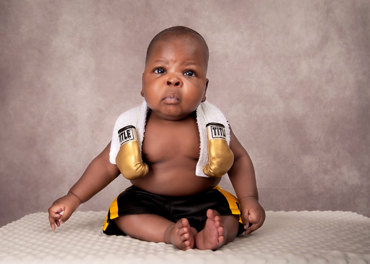 Baby milestone portrait in a boxing outfit