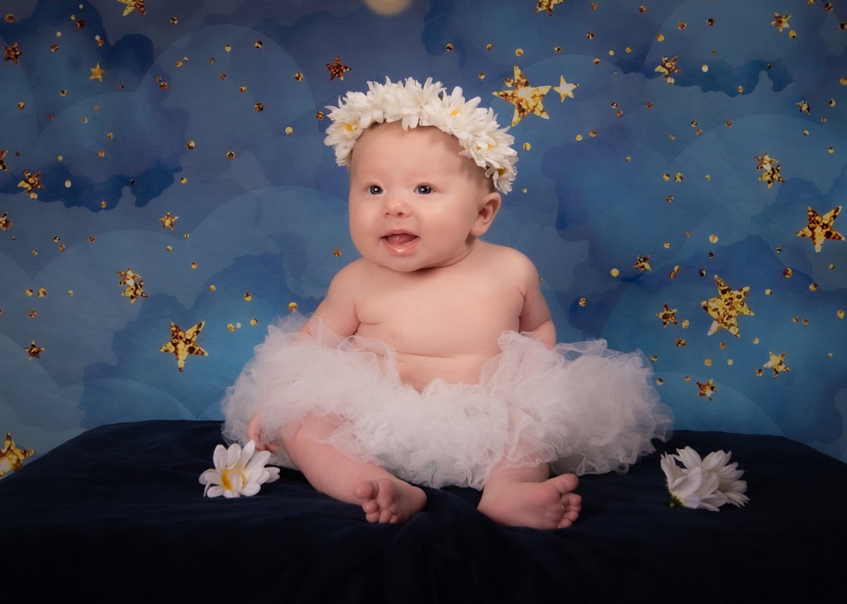 Baby milestone portrait on a star backdrop