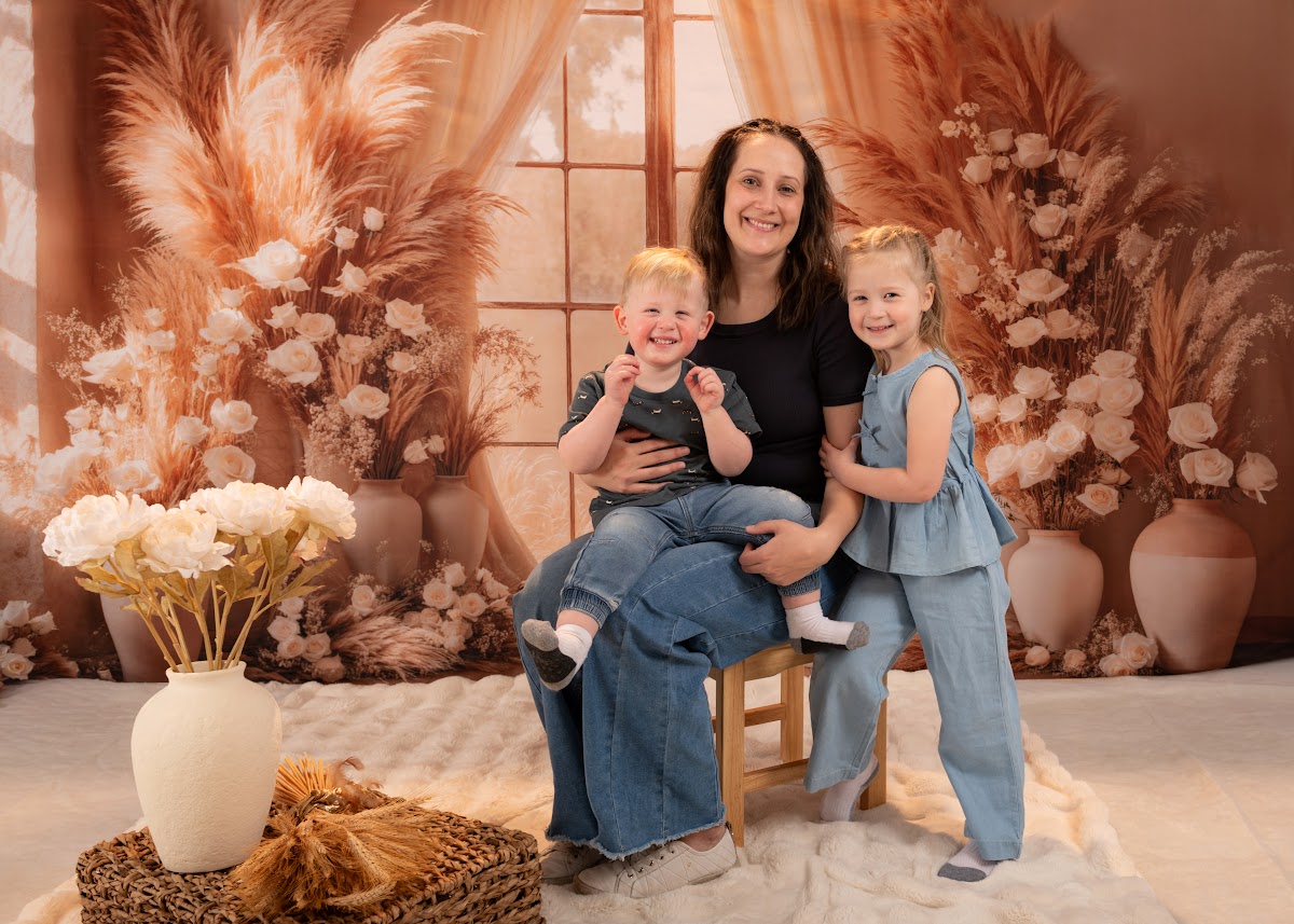 Mother with two children family portrait