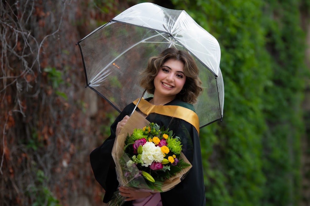 Graduate portrait with an umbrella