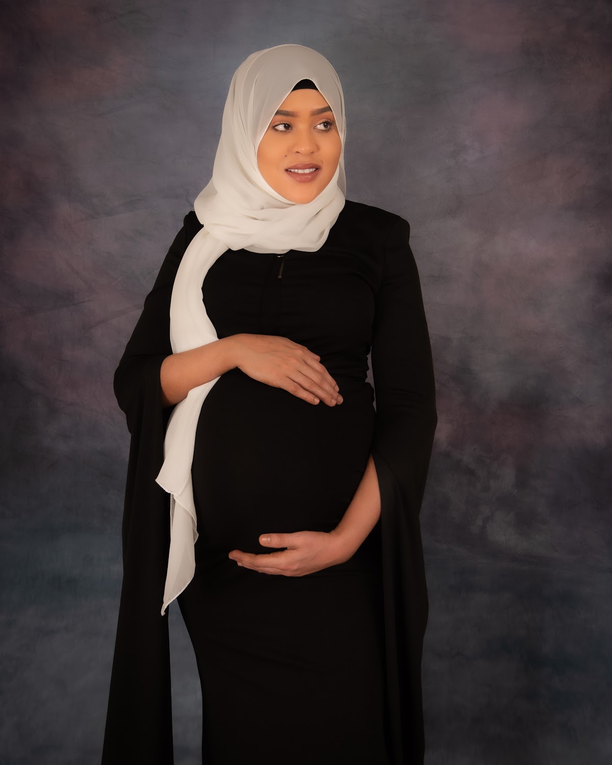 Maternity portrait in a black dress