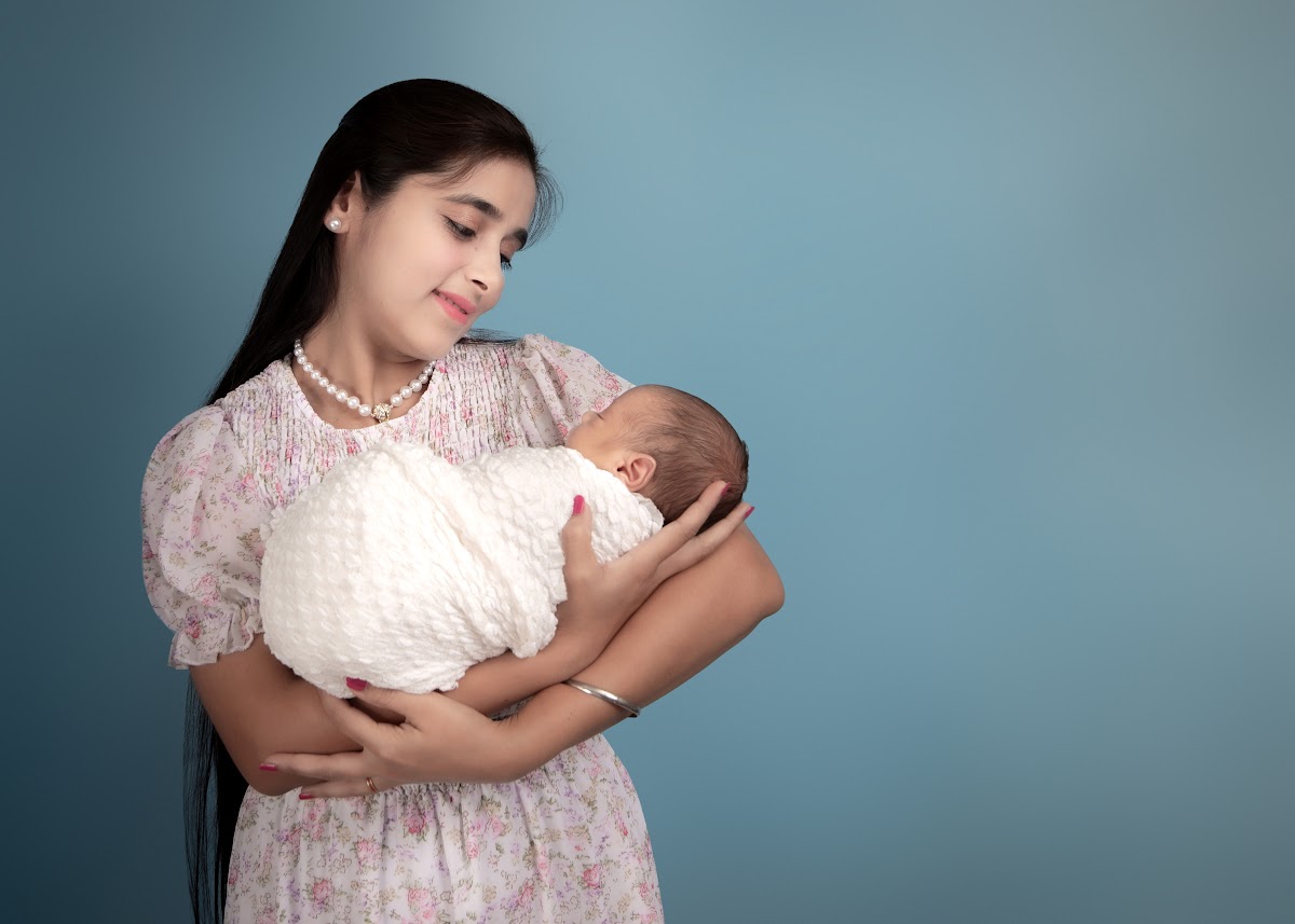Mother holding her newborn baby